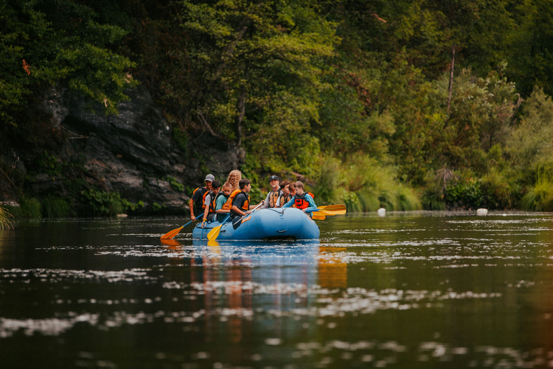 group of people white water rafting with hawks nest rafting