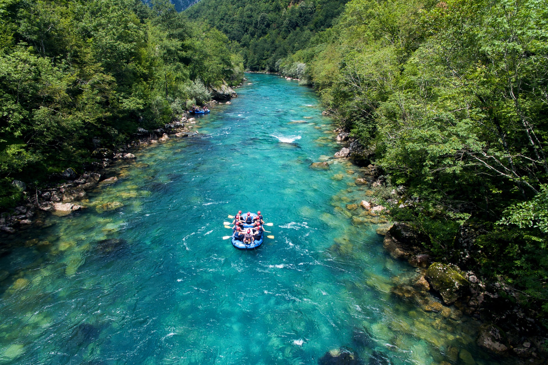 group of people white water rafting with hawks nest rafting
