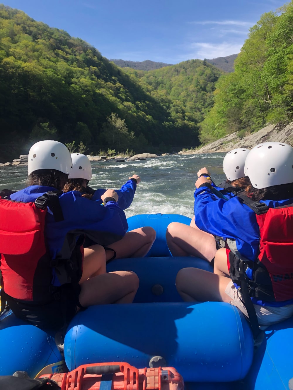 group of people white water rafting with hawks nest rafting